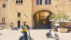 Cycling around the Archbishop's Palace in Narbonne, France
