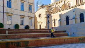 Unusual fountain, cycling in Nîmes, France