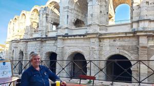 Mike in front of the amphitheatre in Arles, France