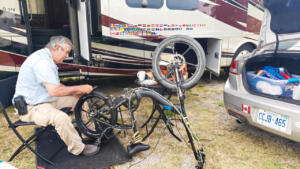 Mike installing new inner tube and rear tire. 
