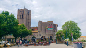 Square with awful belltower in Agde, France
