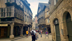Mike wandering the streets of Dinan, France amidst the half timbered houses.