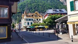 Downtown Interlaken, Switzerland with water and mountains all around.