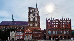 Interesting town hall with smaller buildings in front of it in Stralsund, Germany