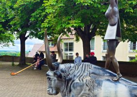 Weird statue with Alphorn in the distance. Sounded great. Breisach, Germany