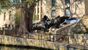 Bronze cowboy with steers on the Riverwalk in San Antonio, Texas