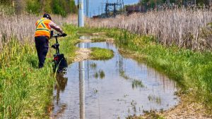 Mike walking his bike and then mine through a path turned into a swamp. Not pleasant.