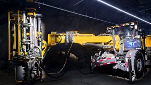 Hybrid Drill in Sudbury Mine under LED light strip.