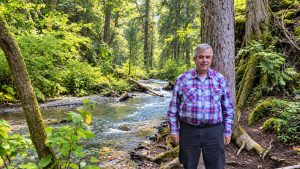 Mike hiking to Brisco Falls near Golden, BC with lots of Kokanee salmon in the water ready for spawning.