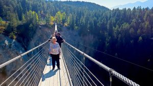Jackie on the lower suspension bridge at Golden's Skybridge Park in BC.