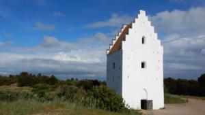 Church tower, main bldg covered by sand over centuries       